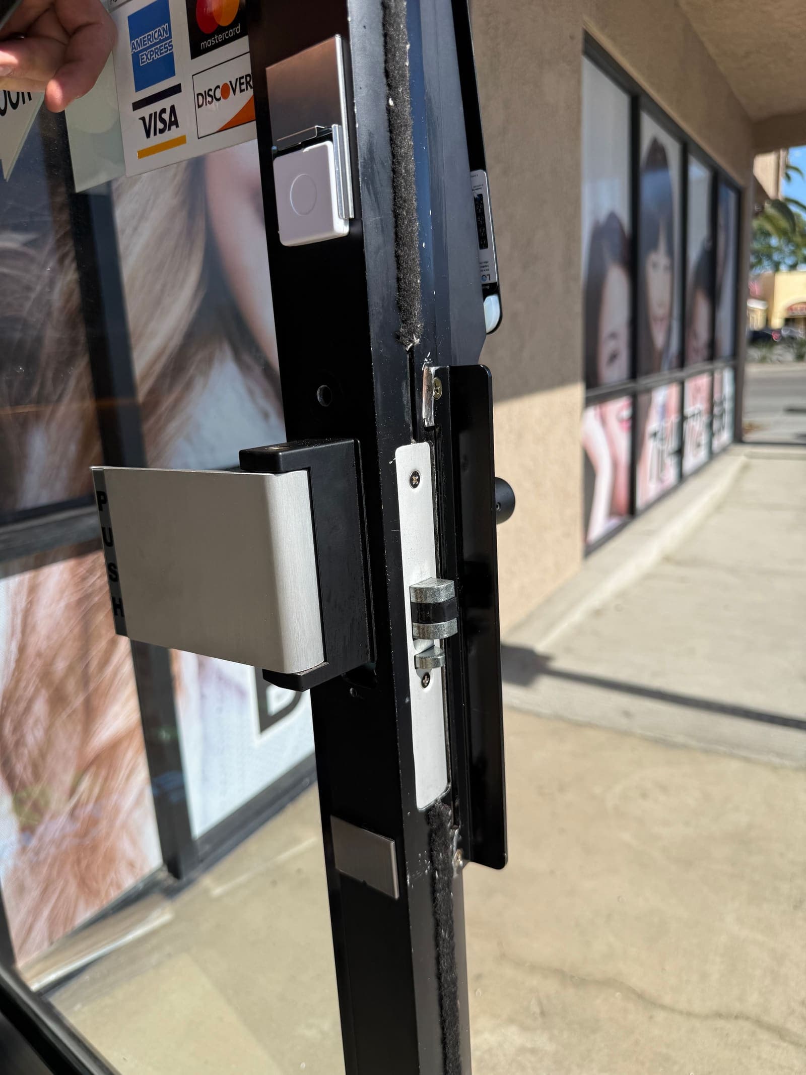 Lockly storefront hookbolt strike closeup — smart lock install job by OH Lock and Key Solutions, Orange County (BSIS #8663)